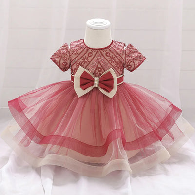 Robe princesse bébé rouge foncé avec motifs floraux et nœud crème