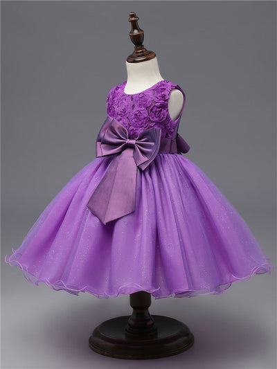 Robe princesse bébé violet motif floral avec nœud en satin et jupe en tulle scintillante