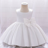 Robe cérémonie fille crème sans manches avec grand noeud et jupe évasée