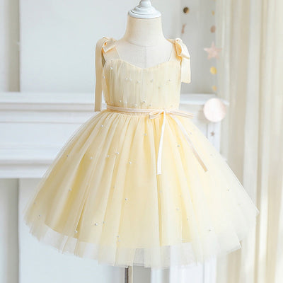 Robe cérémonie fille pastel avec détails perlés et nœuds
