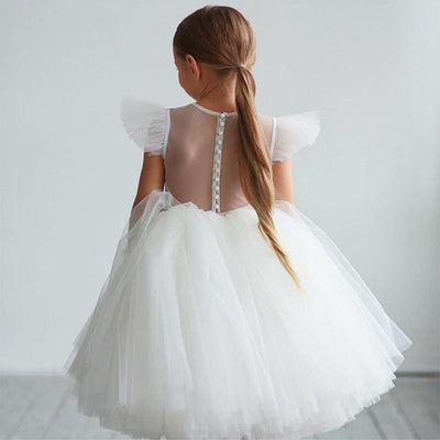 Robe princesse fille blanche avec jupon volumineux en tulle et manches à volants