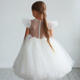 Robe princesse fille blanche avec jupon volumineux en tulle et manches à volants