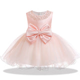 Robe princesse bébé rose pâle avec grand nœud en satin