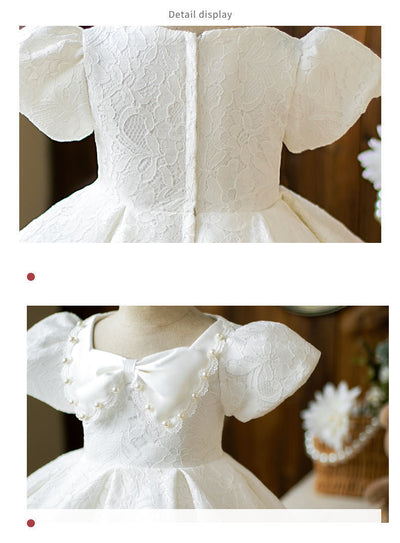Robe cérémonie fille blanche en dentelle avec manches bouffantes et nœud à perles