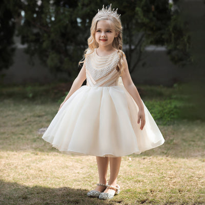 Robe cérémonie fille blanche avec motif perles sur le buste et bas volumineux