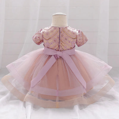 Robe princesse bébé rouge foncé avec motifs floraux et nœud crème