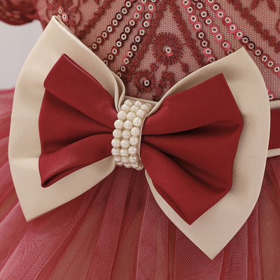 Robe princesse bébé rouge foncé avec motifs floraux et nœud crème