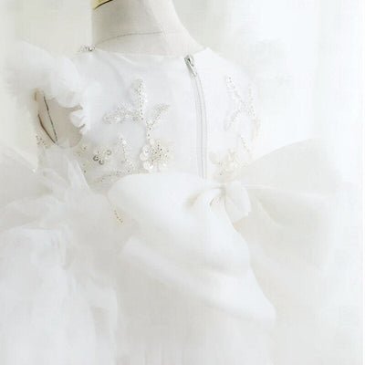 Robe cérémonie fille blanche avec motifs floraux et perles, jupe en tulle bouffante