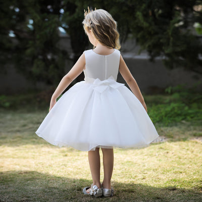Robe cérémonie fille blanche avec motif perles sur le buste et bas volumineux
