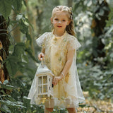 Robe princesse bébé beige à motifs étoiles dorées et broderies délicates