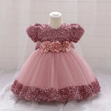Robe princesse bébé rose à sequins et tulle avec ceinture fleurs
