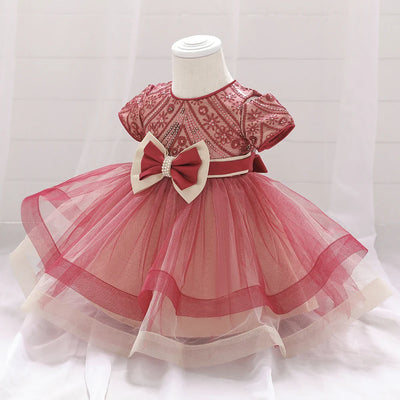 Robe princesse bébé rouge foncé avec motifs floraux et nœud crème
