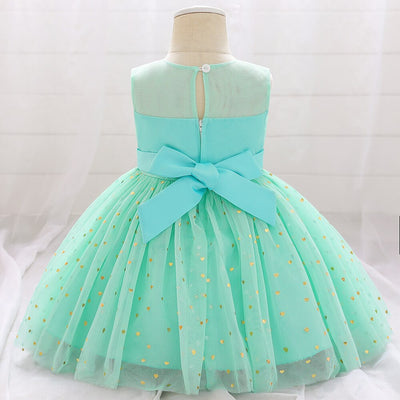 Robe princesse bébé vert menthe avec nœud et motifs cœur dorés