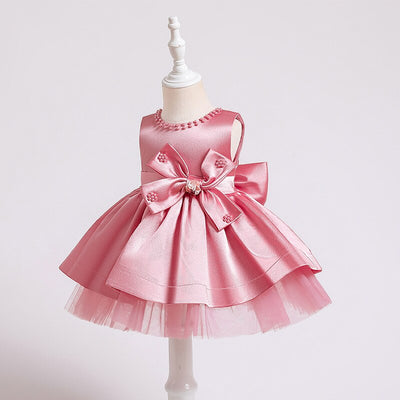 Robe princesse bébé rose avec nœud décoratif et perles