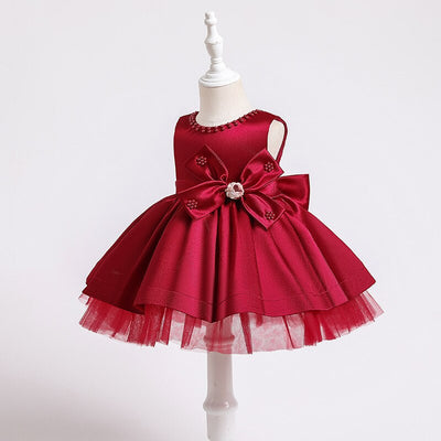 Robe princesse bébé rose avec nœud décoratif et perles
