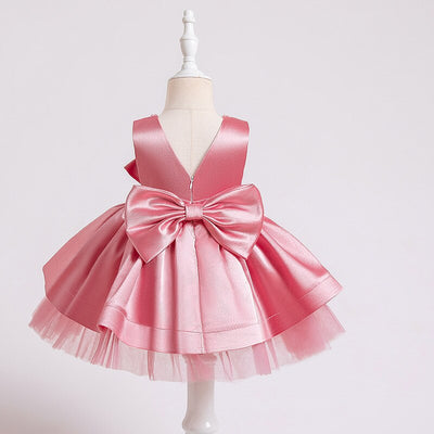 Robe princesse bébé rose avec nœud décoratif et perles