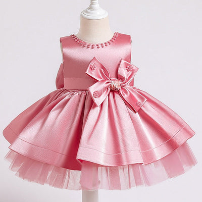 Robe princesse bébé rose avec nœud décoratif et perles