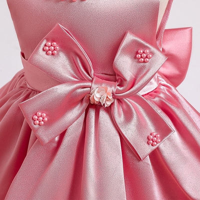 Robe princesse bébé rose avec nœud décoratif et perles