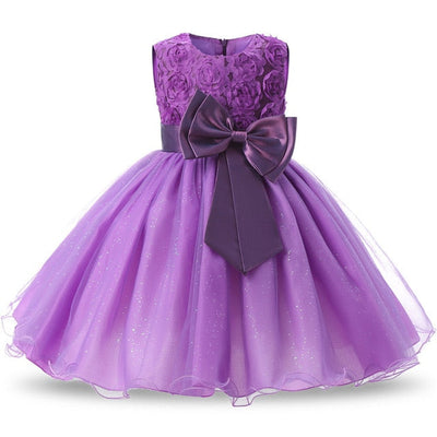 Robe princesse bébé violet motif floral avec nœud en satin et jupe en tulle scintillante