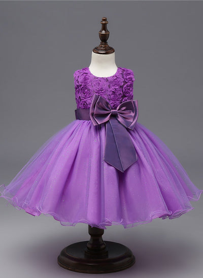 Robe princesse bébé violet motif floral avec nœud en satin et jupe en tulle scintillante