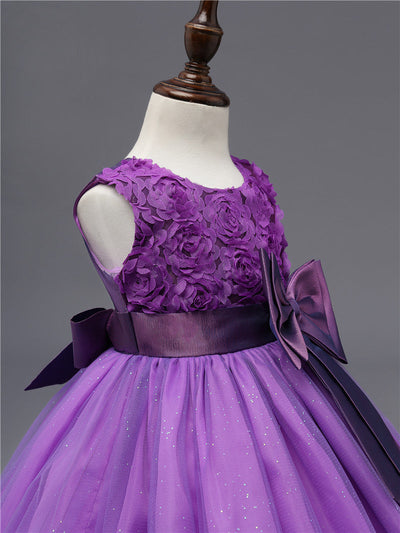 Robe princesse bébé violet motif floral avec nœud en satin et jupe en tulle scintillante