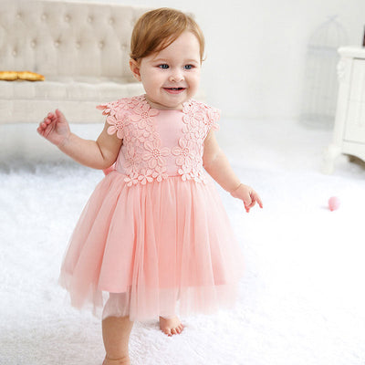Robe baptême bébé fille rose pâle motif floral en tulle