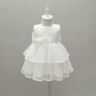 Robe baptême bébé fille en dentelle blanche avec nœud et volants superposés