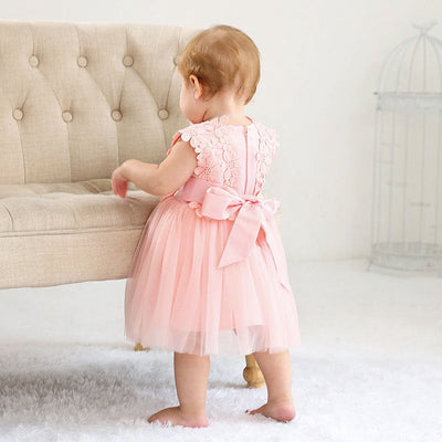 Robe baptême bébé fille rose pâle motif floral en tulle