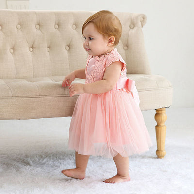 Robe baptême bébé fille rose pâle motif floral en tulle