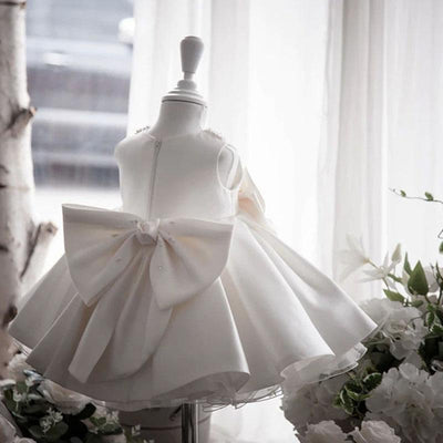 Robe cérémonie fille ivoire col perlé et nœud à la taille en satin