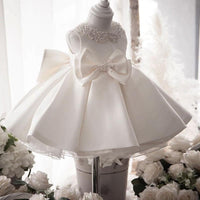 Robe cérémonie fille ivoire col perlé et nœud à la taille en satin