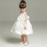 Robe baptême bébé fille blanche avec nœud et col décoré