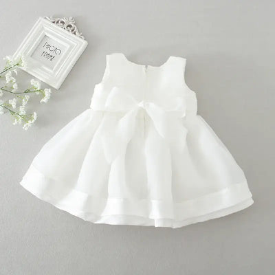 Robe baptême bébé fille blanche avec nœud et col décoré