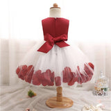 Robe princesse bébé rouge bordeaux avec jupe en tulle blanc et pétales rouges