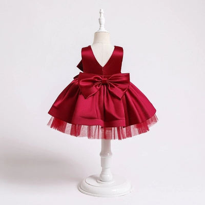 Robe princesse bébé rose avec nœud décoratif et perles