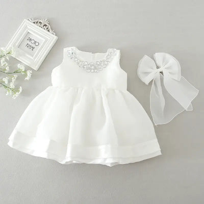 Robe baptême bébé fille blanche avec nœud et col décoré