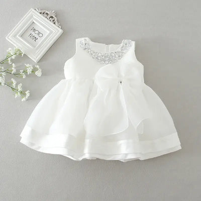 Robe baptême bébé fille blanche avec nœud et col décoré