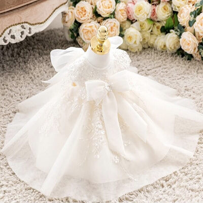 Robe baptême bébé fille ivoire avec dentelle et nœud blanc