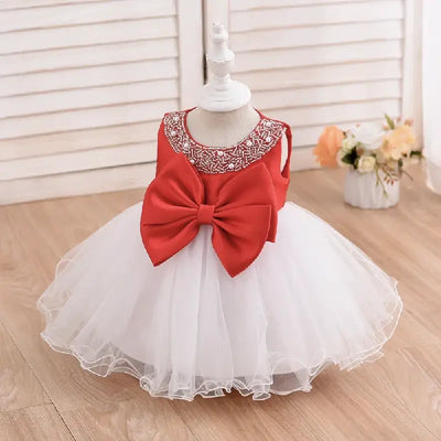 Robe princesse bébé rouge à jupe blanche en tulle avec nœud et col brodé argenté